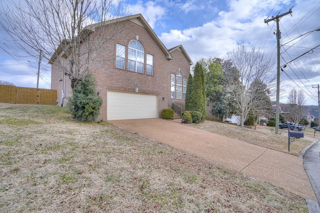 view of front facade featuring a garage and a front lawn