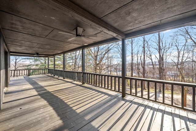wooden terrace featuring ceiling fan