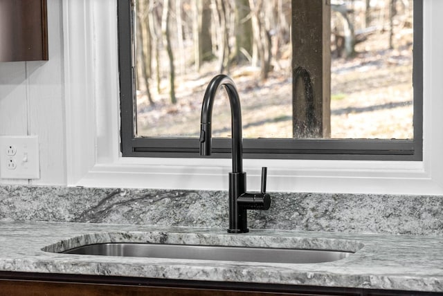 room details with sink and light stone counters