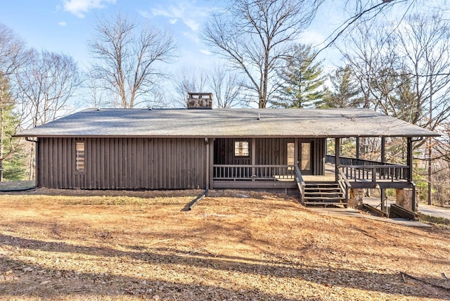 ranch-style home with a wooden deck