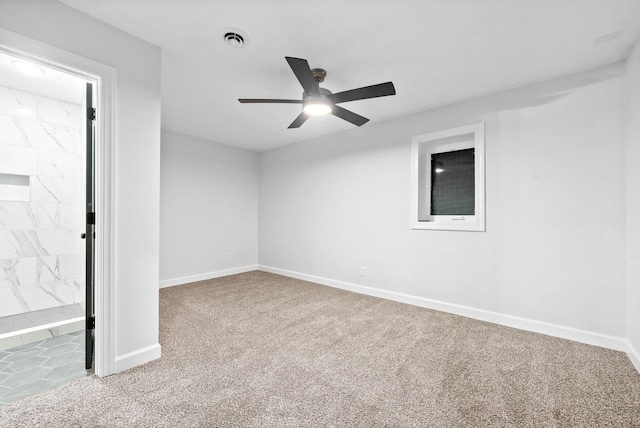 carpeted empty room with ceiling fan