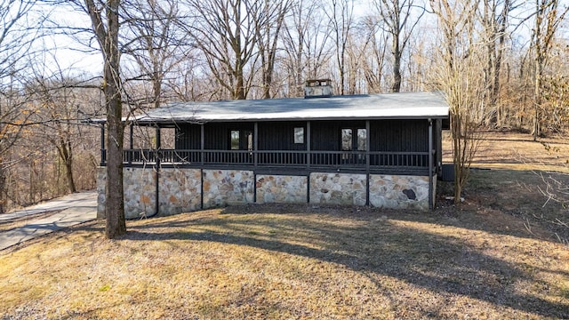 back of house with a yard