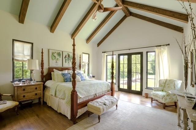 bedroom featuring light hardwood / wood-style flooring, french doors, access to exterior, high vaulted ceiling, and beamed ceiling