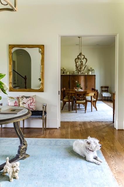 living area featuring hardwood / wood-style floors and a notable chandelier