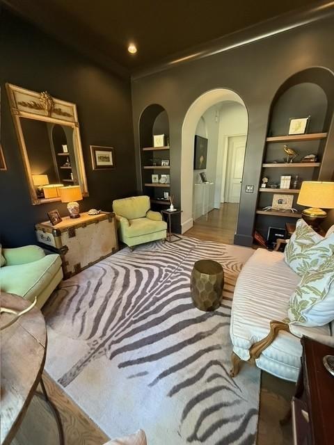 sitting room featuring built in shelves