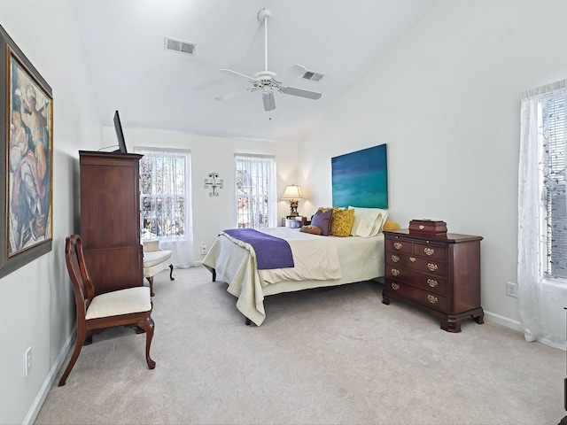 bedroom featuring lofted ceiling, light carpet, and ceiling fan