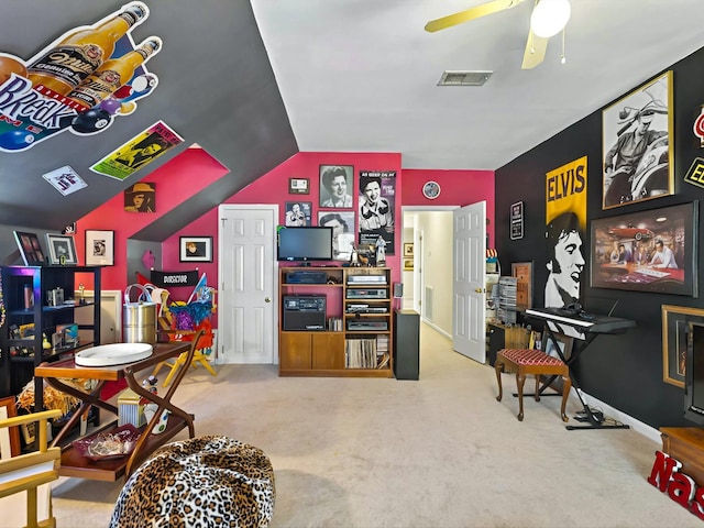 recreation room featuring vaulted ceiling, ceiling fan, and carpet