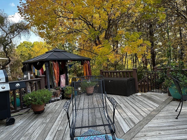 wooden deck featuring a gazebo