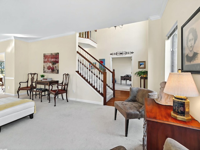 carpeted living room with ornamental molding