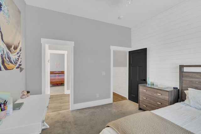 bedroom featuring light colored carpet