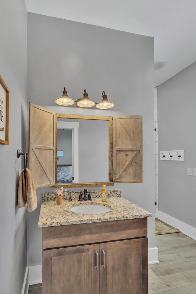 bathroom featuring vanity and hardwood / wood-style floors