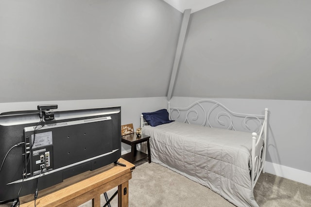 bedroom featuring vaulted ceiling and carpet floors