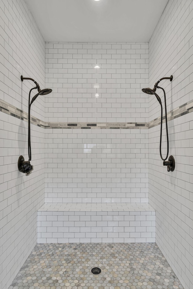 bathroom with tiled shower