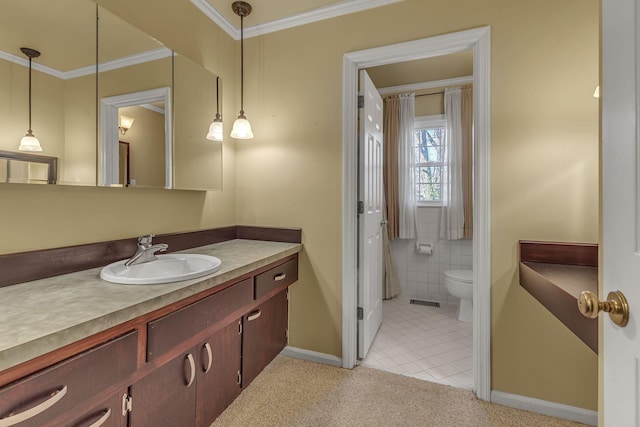 bathroom featuring tile patterned flooring, ornamental molding, vanity, and toilet