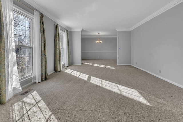 unfurnished room with ornamental molding, light carpet, and a notable chandelier