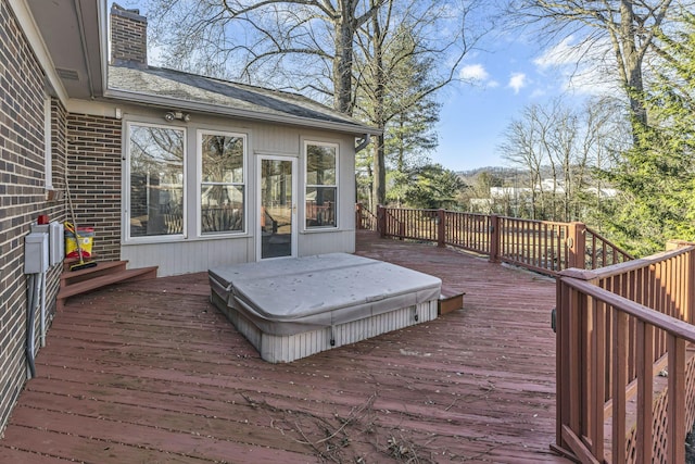 wooden terrace with a covered hot tub