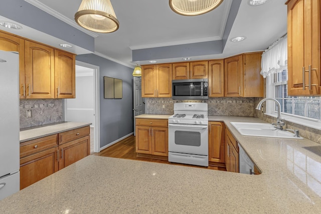 kitchen featuring sink, white appliances, ornamental molding, and decorative backsplash