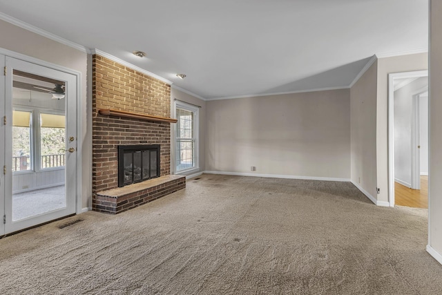 unfurnished living room featuring ornamental molding, carpet flooring, and a brick fireplace