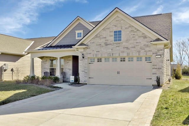 view of front of property with a garage, a porch, and a front yard