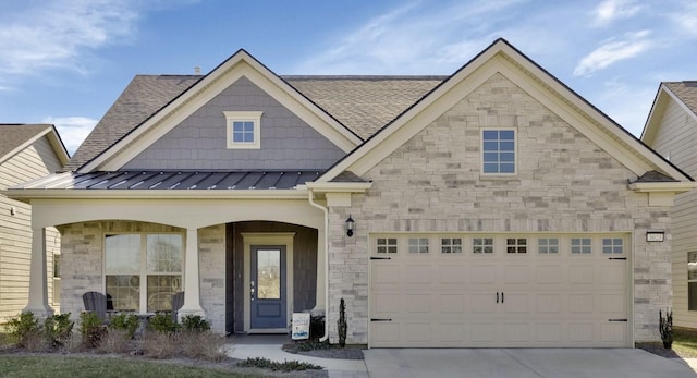 view of front of home featuring a garage and covered porch