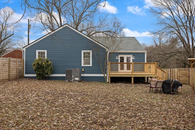 back of house with central AC, french doors, and a deck