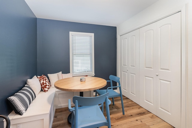 dining space with light hardwood / wood-style floors