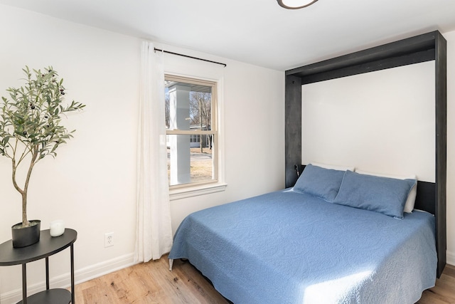 bedroom featuring wood-type flooring