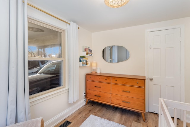 bedroom with light wood-type flooring