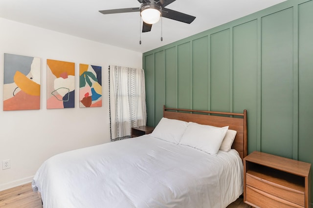 bedroom featuring ceiling fan and light hardwood / wood-style floors