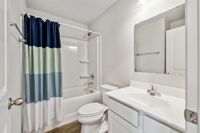 full bathroom with vanity, wood-type flooring, toilet, and shower / bath combo