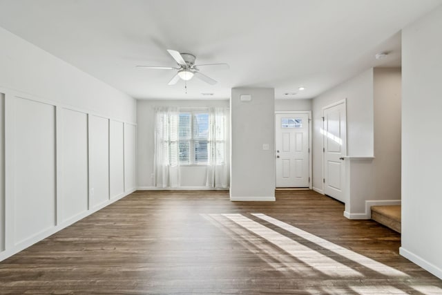 interior space with dark hardwood / wood-style floors and ceiling fan