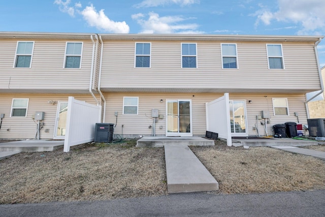 multi unit property featuring cooling unit and a patio area