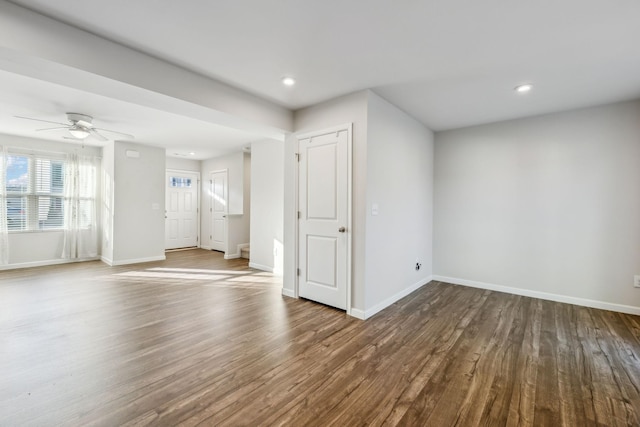 unfurnished room with ceiling fan and wood-type flooring