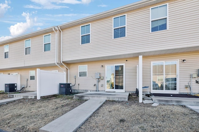 back of property with a patio and central AC unit