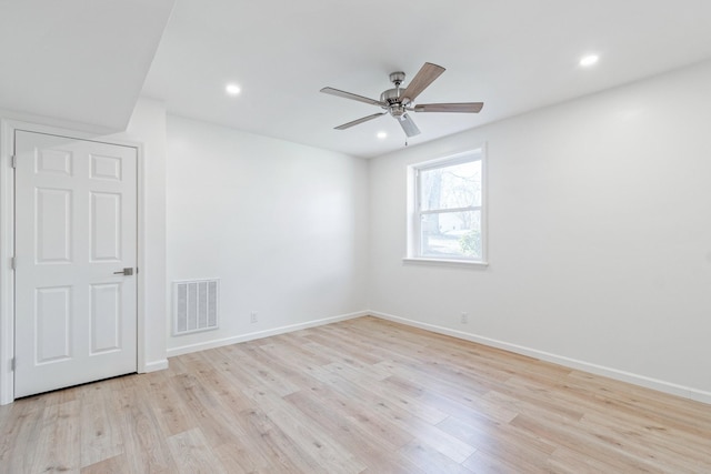 unfurnished room featuring light hardwood / wood-style floors and ceiling fan