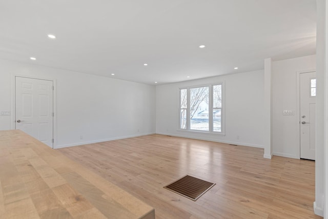 spare room featuring light wood-type flooring