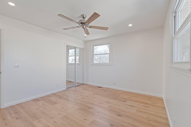 unfurnished room with ceiling fan and light hardwood / wood-style flooring