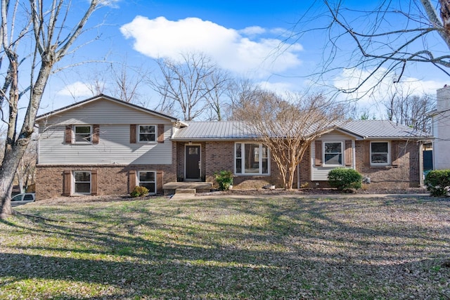 split level home featuring a front lawn