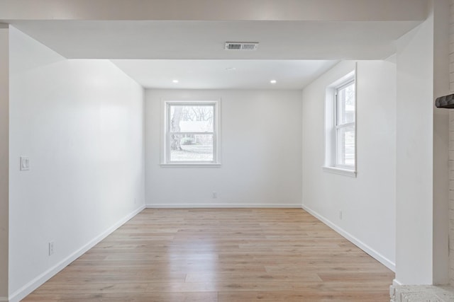 empty room with light hardwood / wood-style floors