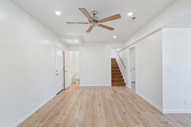 unfurnished room with ceiling fan and light hardwood / wood-style flooring