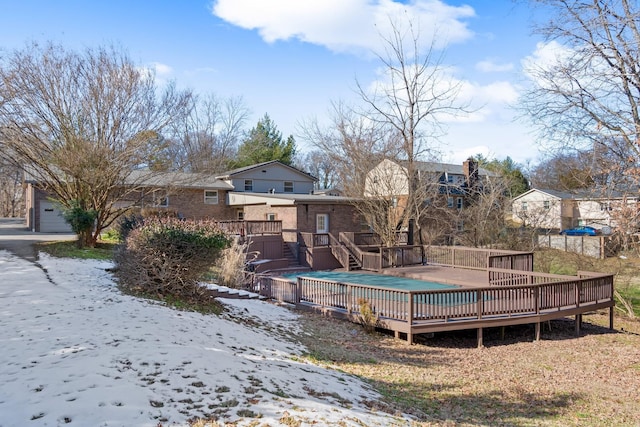 view of swimming pool featuring a wooden deck