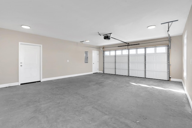 garage with a garage door opener and electric panel