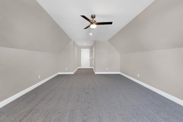 bonus room with vaulted ceiling, carpet flooring, and ceiling fan