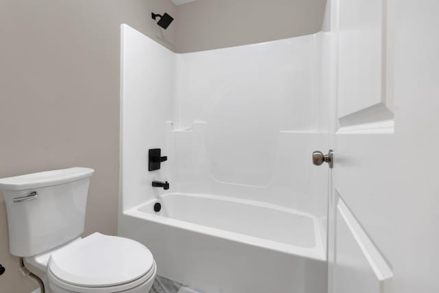 bathroom with shower / bathtub combination and toilet