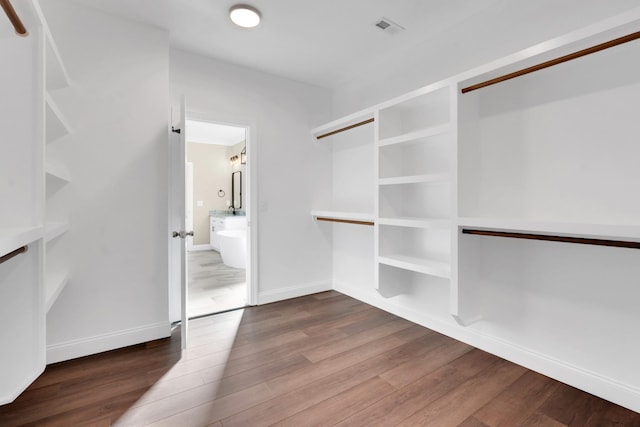 walk in closet featuring hardwood / wood-style floors