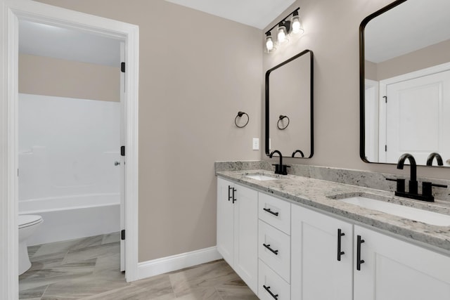 full bathroom with vanity, shower / washtub combination, and toilet