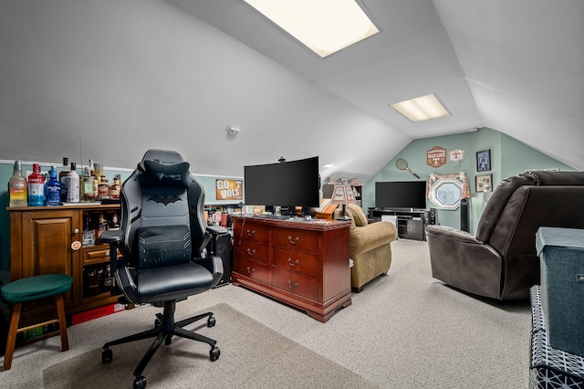 office space featuring lofted ceiling and light colored carpet