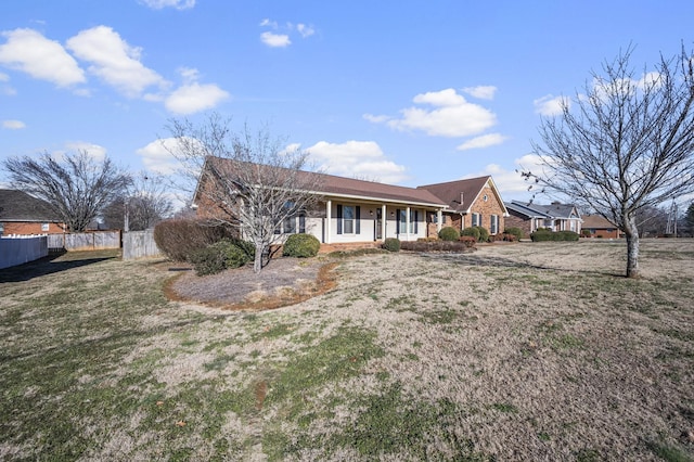 single story home featuring a front lawn