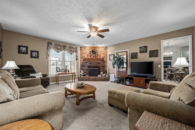 carpeted living room with a brick fireplace, a textured ceiling, and ceiling fan