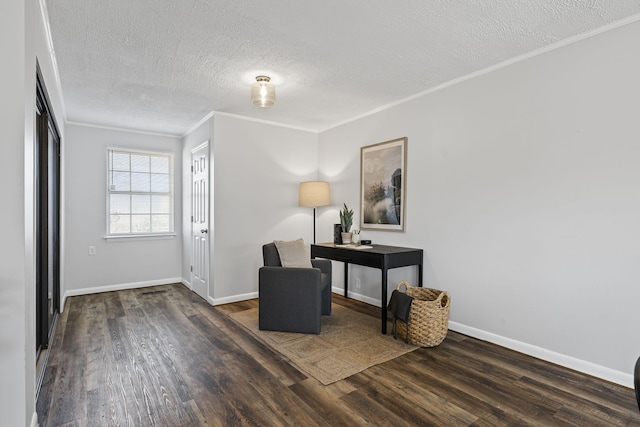 foyer entrance featuring ornamental molding, a textured ceiling, and dark hardwood / wood-style flooring